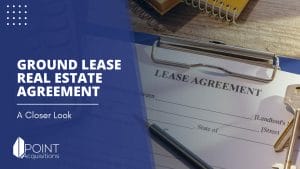 a clipboard with document and a key on it with a caption of ground lease real estate agreement