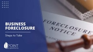 a brown gavel on top of a document saying foreclosure notice with a house model