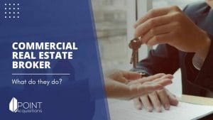 A commercial real estate broker handing keys to a client